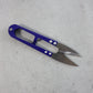 Close-up view of sharp stainless steel blades on sewing scissors