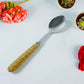 Elegant stainless steel dining spoon set with decorative handles for serving