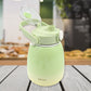 The 1200ml travel mug with its lid open, revealing a straw and included sticker sheet.