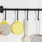 Close-up image of double-sided kitchen cleaning dishwashing sponge brush