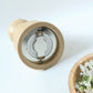 Traditional wooden pepper grinder featuring hand twist mechanism for freshness