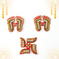 Assorted Laxmi Charan and Swastik decals in bright hues for Diwali décor
