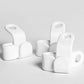 Organised display of white hanger connector hooks for closet management.