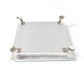 Silver pooja platform with a serene Ganesha carving, ideal for home temples and altars.