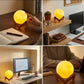 Cordless moon lamp on wooden stand for cozy lighting