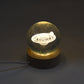 The astronaut 3D crystal lamp glowing softly, creating an ambient atmosphere.
