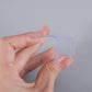 Clear double-sided nano adhesive tape on a roll for multi-surface applications.