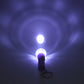 Mini LED keychain torch showing push-button switch and plastic body