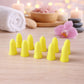 Foam ear plugs arranged neatly, ready for noise reduction use