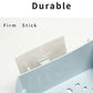 White plastic storage shelf featuring integrated hooks for hanging small items.