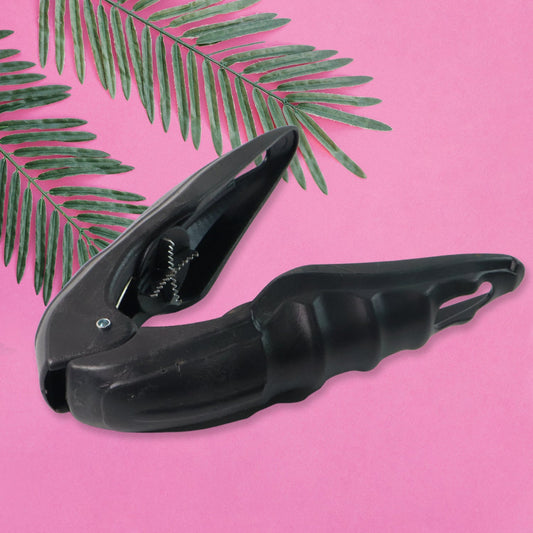 Dual purpose nut and seafood cracking tool with ergonomic grip