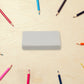 A collection of cute erasers in various shapes and colours for kids.