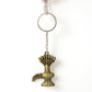 Close-up of Lord Shiva Shivaling metal keychain with detailed serpent design