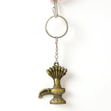 Close-up of Lord Shiva Shivaling metal keychain with detailed serpent design