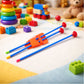A detailed view of the plastic toy knife and arrows from the Kids Archery Set.