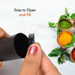 Two sleek spice dispensers enhancing a contemporary dining table setting.