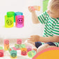 A collection of colorful slinky spring toys scattered on a clean surface.