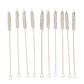 Nylon bristles cleaning a reusable metal straw with the brush from the set