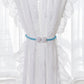 Set of two magnetic curtain tiebacks featuring pearl accents