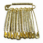 Golden safety pin brooch clips viewed from top showcasing smooth edges