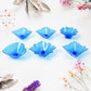 The elegant plastic candle holders from the Diwali Diya Set displayed on a surface.