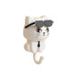 Hand holding the Styleva cat wall hook, highlighting its smooth finish and convenient size.