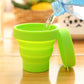 Collapsed foldable silicone travel mug with lid, ready for packing.