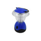 The Indo Glow Mini Camping Lantern emitting a powerful white LED light in a dark environment.