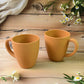 Konvex coffee mugs placed on a wooden table