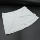 Women's high-waisted athletic skort front view in white.