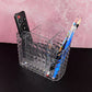 Close-up view of crystal-clear multipurpose organizer holder with compartments