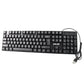 Person typing comfortably on the Wired USB Keyboard at a home office desk setup.