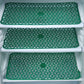 Fridge drawer mats preventing spills and scratches.