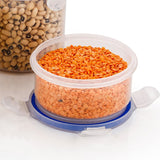 Set of three round airtight food storage containers with transparent bodies and blue leakproof lids.