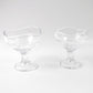 Clear glass dessert bowl highlighting its sturdy footed base.