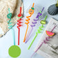Detailed view of safe and soft PET cartoon truck attachments on reusable straws.