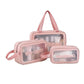 Hand holding a portable cosmetic pouch, highlighting its convenient size for travel.