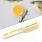 Efficient fish cleaning tool with built-in brush and grater.