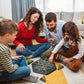 Children engaged in Educational Triangle Puzzle Game during group play session
