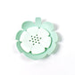 Plastic soap dish with unique lotus flower design, ideal for keeping soap dry.