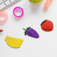 A playful pile of diverse 3D food erasers, ready for creative fun.