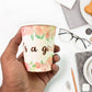Empty disposable paper cups in a colourful assortment.