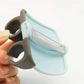 Close-up of the ergonomic Palm Peeler with its soft rubber finger grip.