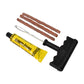 Essential tools from the tubeless tyre puncture repair kit ready for use.