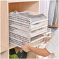 Compact stack of empty clothes organizer boards, showing how they store easily when not in use.