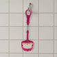 Easy-to-clean food-grade potato masher under running water.
