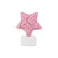 Group of flameless star shaped LED tealight candles shining softly