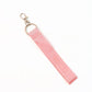 Metal ring of key holder attached to Girl Power fabric ribbon keychain