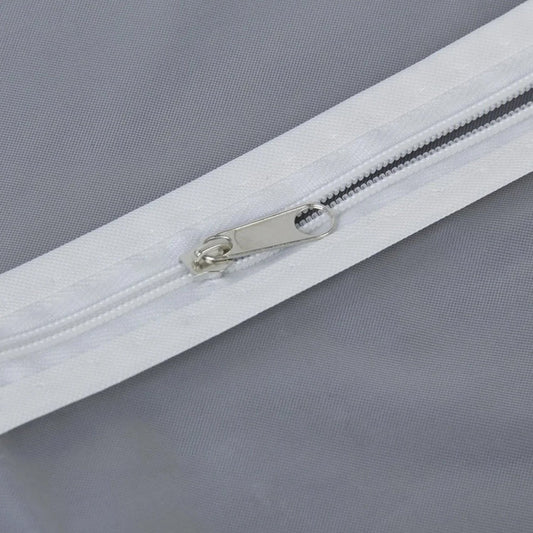 Closeup of full-length zipper on suit cover with breathable fabric.