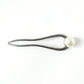 Close-up of pearl hair pin detail